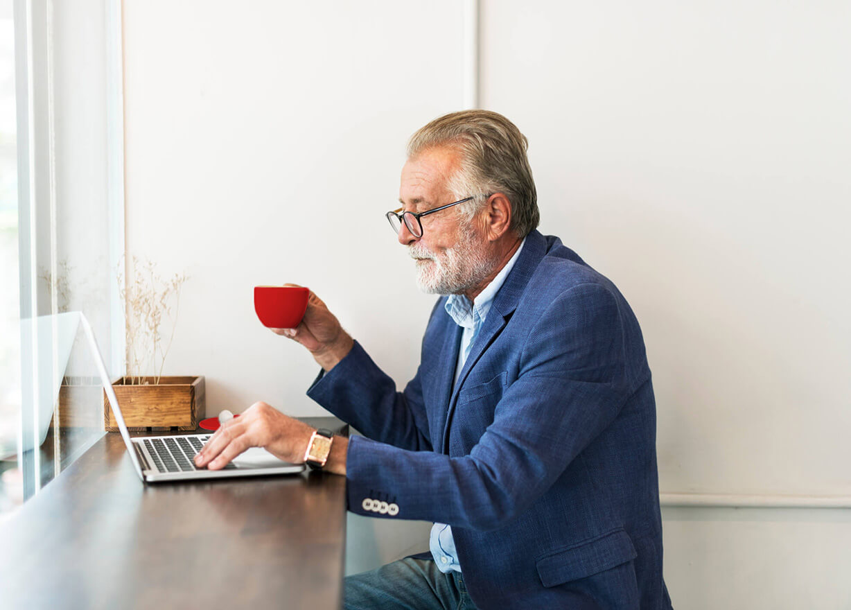 Older man using laptop