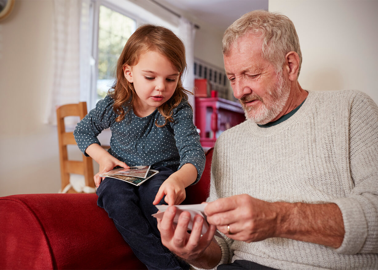 Granddaughter sitting with grandad