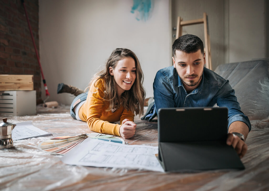 Young couple using tablet
