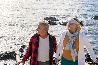 Couple hiking by a beach