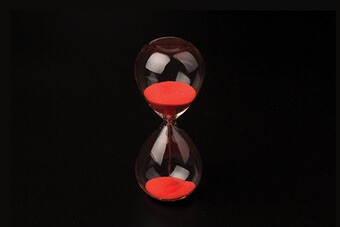 Red hourglass black background