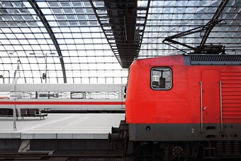 Red train entering station