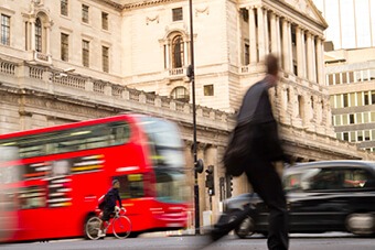 man walking down high street 