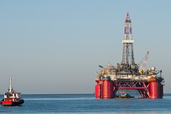 Red oil rig at sea