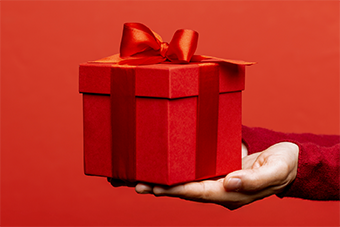 Red present box against red background