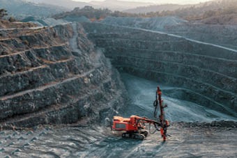 Red digger mining for metal