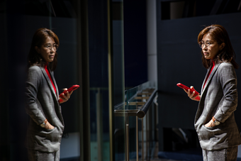Woman standing on her phone
