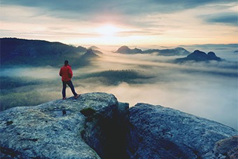 Man overlooking mountain