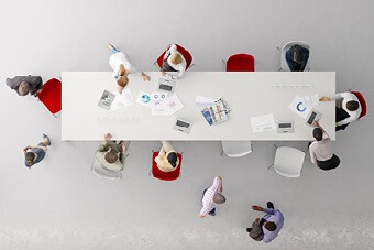 Business people sat around a table