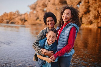 Mother with daughter and son in front of a lake