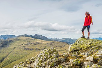Lady standing on hill