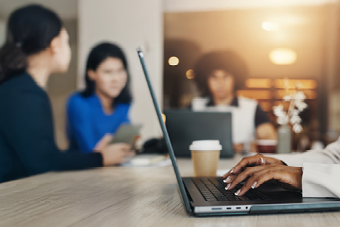 Person working on laptop in office space