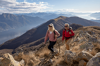 older couple hiking along mountain top