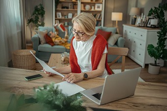 woman looking at paper