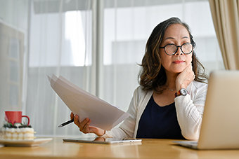 Woman looking at laptop