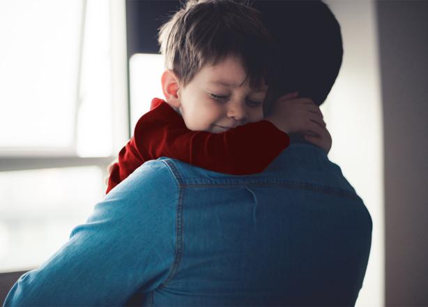 Son hugging father
