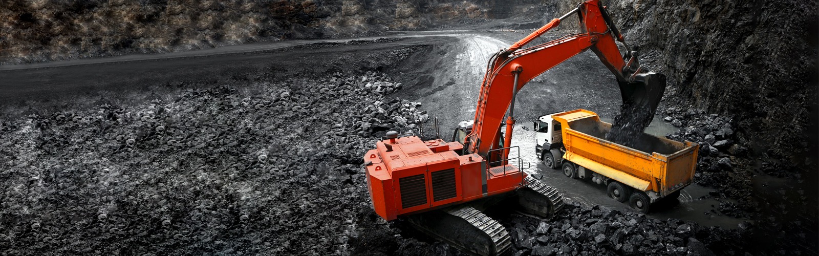 Red digger looking for copper metal 