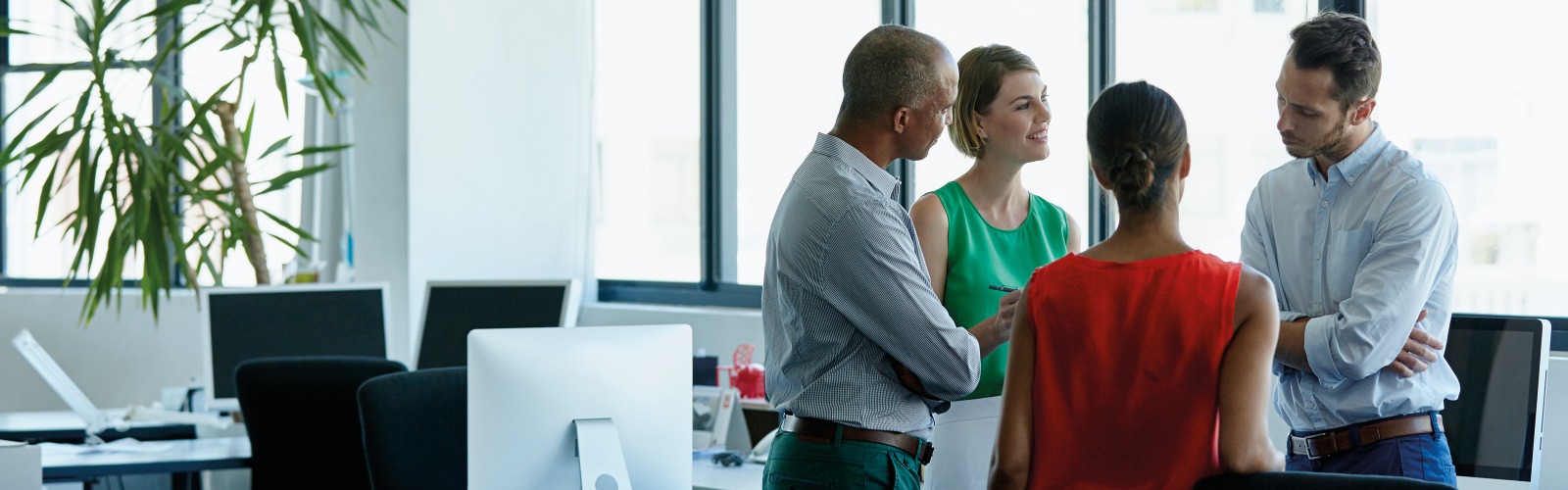 Group of people in an office talking