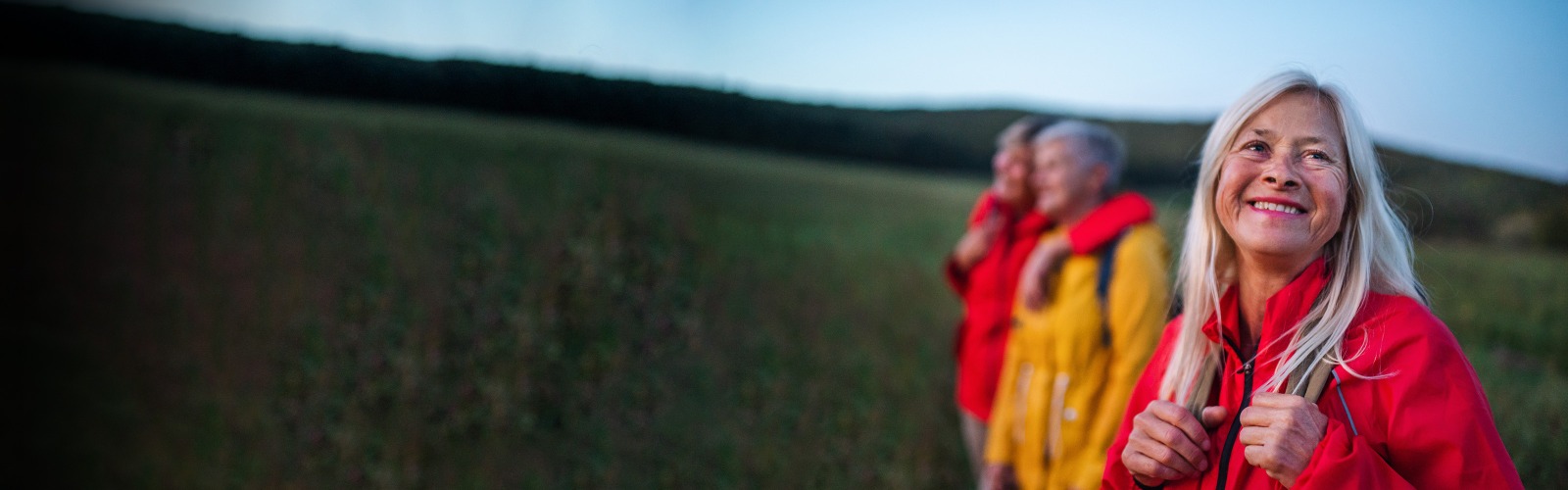woman in red coat smiling