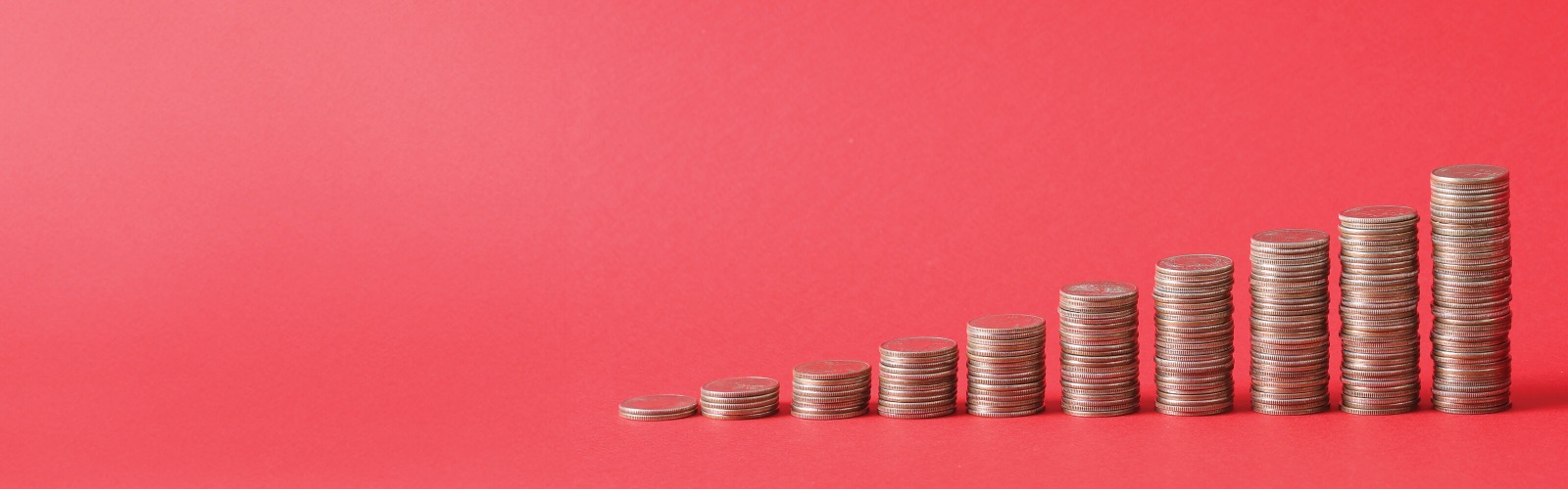 Stacked coins red background