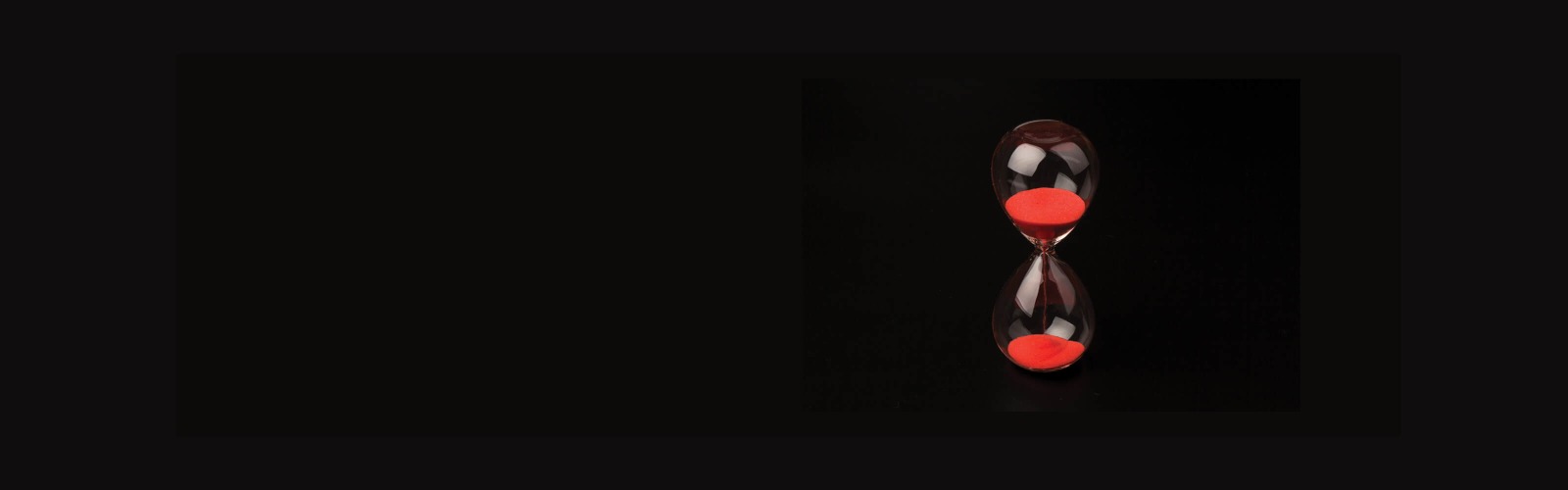 Red hourglass black background