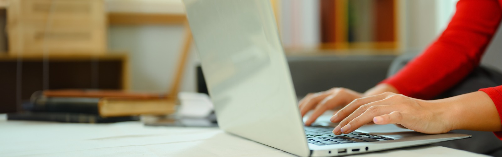 Person typing on laptop