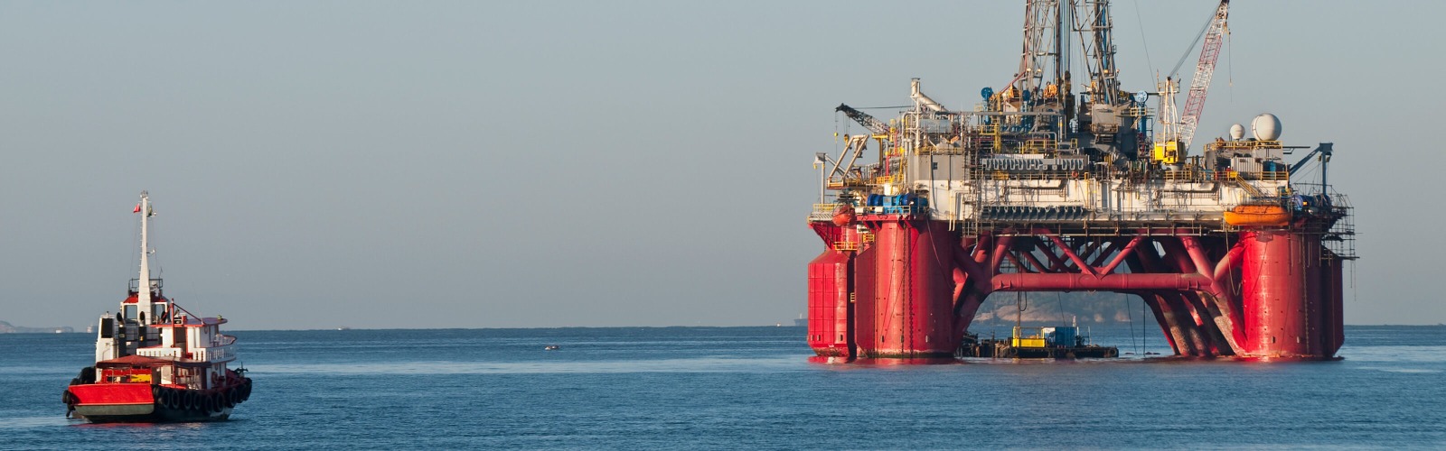 Red oil rig at sea
