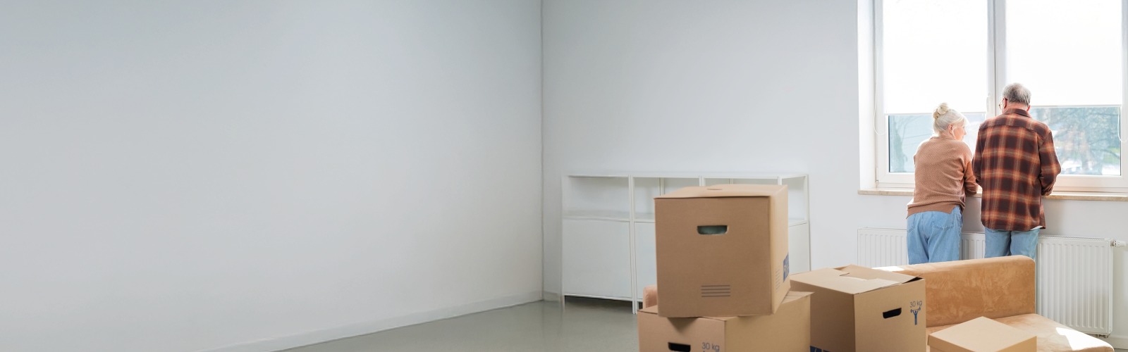 A couple unpacking boxes after moving in 