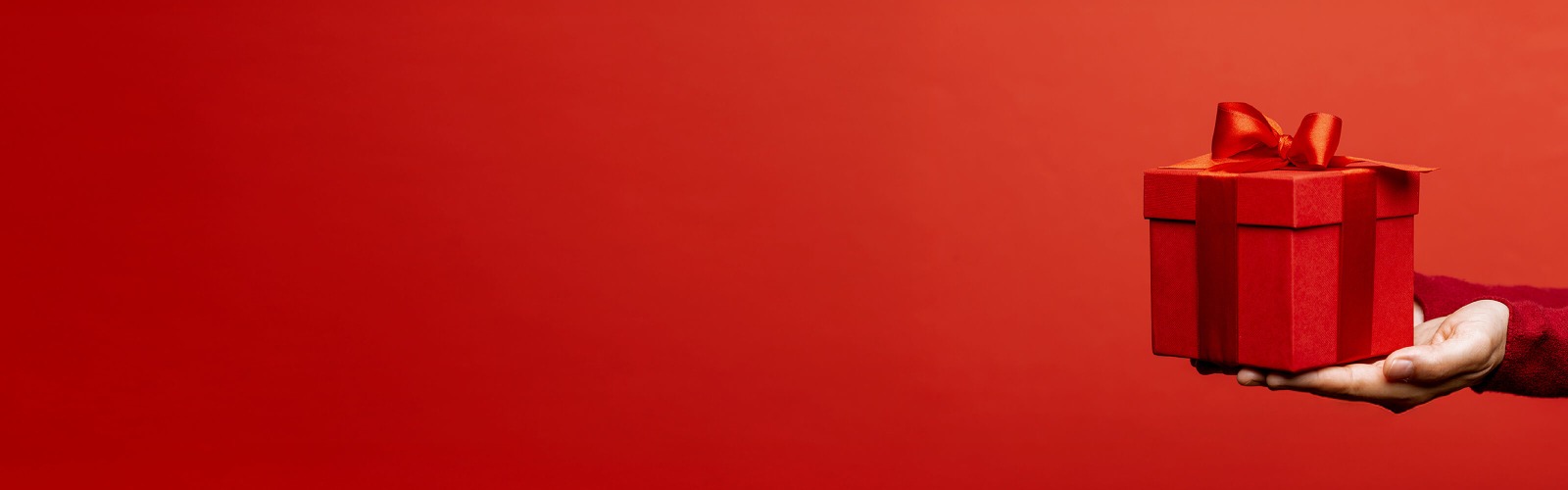 Red present box against red background