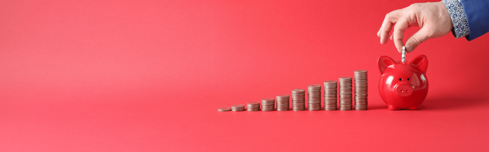 Coins going into a money bank