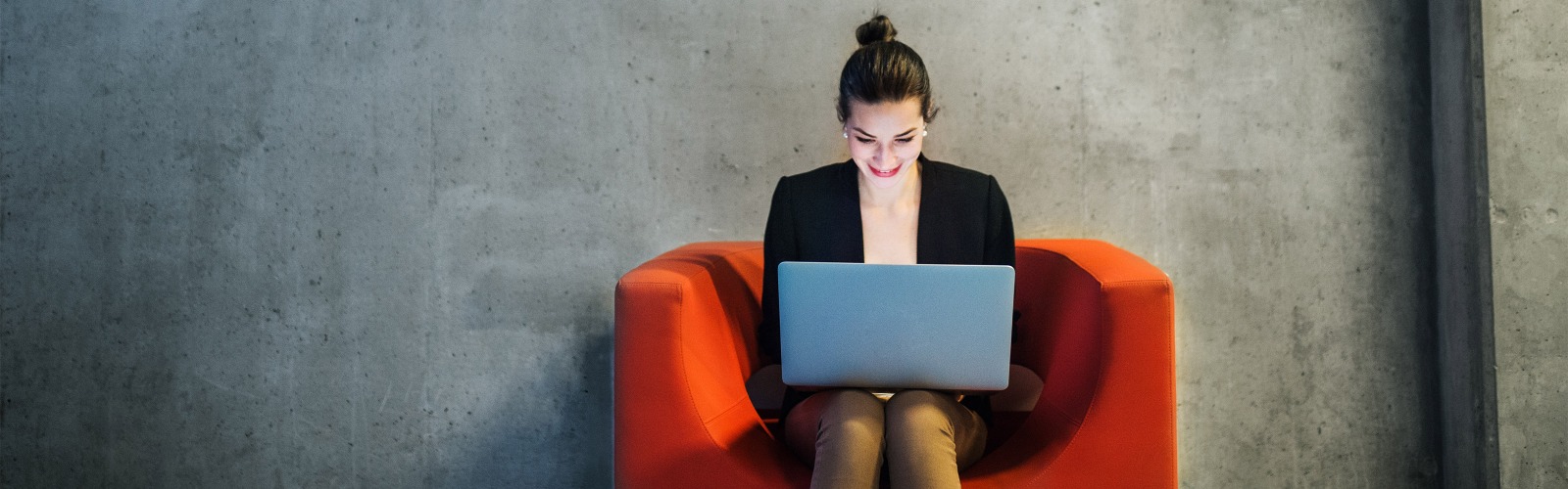 Red chair, women on laptop