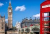 Red phone box in front of the Houses of Parliament 