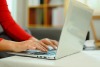 Person typing on laptop